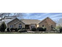 Charming brick home with well-maintained landscaping and inviting entrance, complete with a manicured front yard at 47997 Wagoner Rd, Richfield, NC 28137