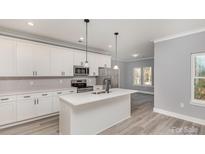 Modern kitchen with a central island, stainless steel appliances, and plenty of cabinet space at 2385 Kool Park Ne Rd # 2, Hickory, NC 28601