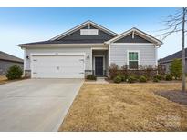 Charming single-story home featuring a two-car garage and well-maintained landscaping at 4919 Trigney Ct, Charlotte, NC 28214