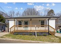 Charming single-story home with a welcoming front porch and a well-maintained lawn at 544 Baltimore Dr, Cramerton, NC 28032