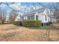 Exterior shot of house on a lot featuring an exterior view and side yard at 63 3Rd Nw St, Concord, NC 28027