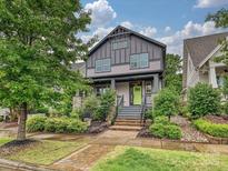 Charming two-story home with landscaped yard, brick walkway, and a vibrant green front door at 817 Digby Rd, Rock Hill, SC 29730