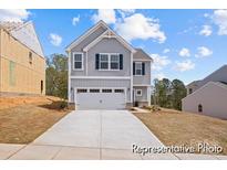 Two-story home with neutral siding, two-car garage, and long driveway at 110 Shay Crossing Rd # 1P, Salisbury, NC 28144