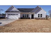 Charming single-Gathering home with a two-car garage and well-maintained lawn at 120 Random Dr, Salisbury, NC 28147