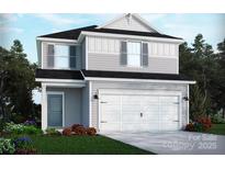 Charming two-story home with a white garage door, gray siding and a landscaped yard at 1405 31St Ne St, Conover, NC 28613