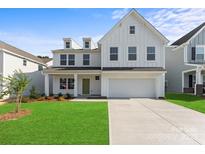Charming two-story home boasts a well-manicured lawn, a classic white facade, and a welcoming green front door at 163 Stonewater Dr # 4P, Red Cross, NC 28129
