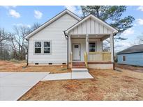 Charming home with a cozy front porch and well-manicured lawn at 228 Chestnut St # 66, Shelby, NC 28150