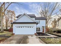 Charming two-story home with a white exterior, a well-manicured front yard, and a two car garage at 3516 Mill Stream Ct, Charlotte, NC 28209