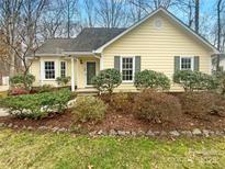 Charming one-story home with a landscaped front yard, green lawn, and inviting entrance at 3709 Sandberry Dr, Waxhaw, NC 28173