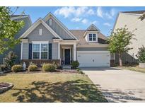 Charming home with grey siding, manicured lawn, and inviting entrance, offers curb appeal at 108 Hillston Ln, Mooresville, NC 28115