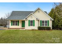 Charming single-story home with green shutters, well-maintained lawn, and inviting curb appeal at 158 Angel Oaks Dr, Statesville, NC 28677