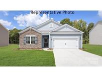 Charming one-story home with stone accents, a two-car garage, and well-manicured lawn at 7921 Old Brook Rd, Sherrills Ford, NC 28673