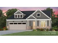 Charming two-story home with gray siding, brick accents, and a well-manicured lawn at 4785 Formation Ct # 101, Lancaster, SC 29720