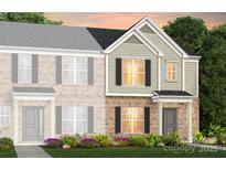 New two-story townhouse with brick and siding, black shutters, and colorful landscaping at 2230 Cobble Ct # 154, Monroe, NC 28110