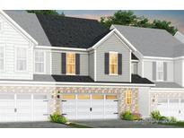 Charming new construction townhome featuring attached garages and a light brick facade at 2241 Cobble Ct # 221, Monroe, NC 28110