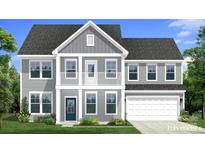 Charming two-story home featuring a covered porch and a two-car garage at 281 Supernova Dr, York, SC 29745
