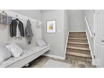Inviting mudroom with coat hooks, bench seating, and stylish decor welcomes you home at 404 Brannon Meadows Dr # 270, York, SC 29745