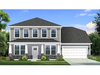 Charming two-story home with a gray color scheme, stone accents, and a well-manicured lawn with lovely landscaping at 633 Regulus Ct, York, SC 29745