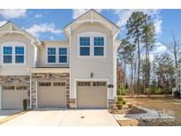 Charming townhome featuring a two-car garage and manicured landscaping at 1348 Southern Sugar Dr, Charlotte, NC 28262
