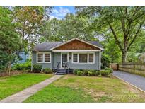 Charming bungalow-style home with well-maintained lawn and landscaped front yard at 2115 Laburnum Ave, Charlotte, NC 28205