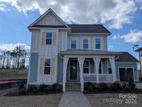 Inviting two-story home with a charming front porch and manicured lawn at 251 Luray Way # 441, Rock Hill, SC 29730