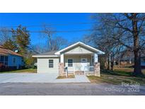 Charming home featuring a inviting front porch and well-manicured yard at 533 3Rd St, Chester, SC 29706