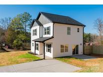 Charming two-story home with black shutters, vinyl siding, a concrete drive, and a manicured lawn at 268 Policarp St, Lincolnton, NC 28092