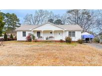 Charming one story home featuring a cozy front porch and well-maintained landscaping on a spacious lot at 431 Island Cove Rd # 86, Norwood, NC 28128
