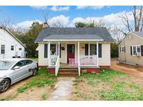 Charming single-story home with a cozy front porch and well-lit pathway at 642 E Black St, Rock Hill, SC 29730
