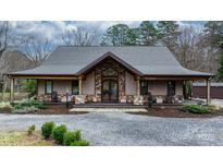 Beautiful home with stone accents, covered porch, double door entry, and meticulous landscaping at 406 Third Ne Ave, Conover, NC 28613