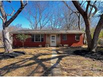 Charming single-story brick home featuring a well-maintained front yard and inviting entrance at 926 Overhill St, Gastonia, NC 28052