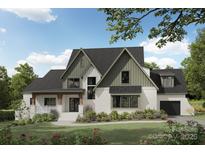 Charming two-story home featuring brick accents, a cozy porch, and well-manicured landscaping at Lot 4 Holbrook Rd, Fort Mill, SC 29715