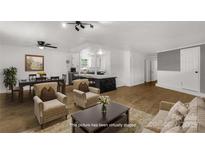 Bright living room boasts wood floors, neutral decor, and an open layout perfect for modern living at 1888 Usher Rd, Lancaster, SC 29720