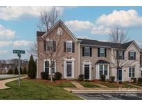 Charming townhome featuring a well-maintained lawn and a classic architectural design at 2692 Norman Isle Dr, Denver, NC 28037