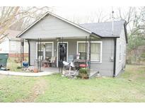 Charming gray single-story home with a covered front porch and landscaped front yard at 1909 Marshall Ave, Gastonia, NC 28052