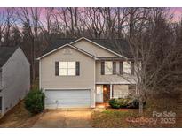 Charming two-story home featuring a two-car garage and inviting front porch at 2349 Gooseberry Rd, Charlotte, NC 28208