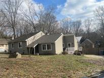 Charming single-Gathering home with a cozy front porch, complemented by mature trees and a well-maintained yard at 6123 Patrick Pl # 7, Charlotte, NC 28210