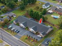 An aerial view of the apartments shows ample parking and a community pool at 810 E Main St, Maiden, NC 28650