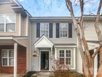 Charming townhouse featuring gray siding, black shutters, and a welcoming entrance at 16837 Greenlawn Hills Ct, Charlotte, NC 28213
