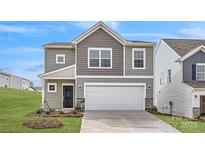 Charming two-story home with a two-car garage, stone accents, and craftsman-style details at 2530 Trollinger Dr, Catawba, NC 28609