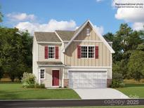 Charming two-story home with red shutters and a two-car garage, offering classic curb appeal at 5318 Small St, Catawba, NC 28609