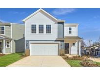 Charming two-story home with a white garage door, classic windows, and a manicured lawn at 5336 Small St, Catawba, NC 28609