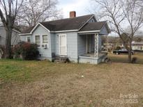 Exterior view of a single-story home with a covered porch and mature trees at 146 Loomis St, Chester, SC 29706