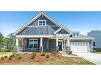 Charming single Gathering home with gray siding, stone accents, white trim, and a welcoming front porch at 231 Miramar Dr, York, SC 29745