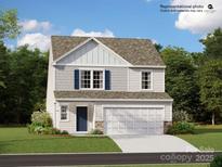 Charming two-story home featuring a two-car garage and a beautifully landscaped front yard at 2545 Trollinger Dr, Catawba, NC 28609