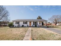 Charming single-story home with well-maintained lawn and inviting curb appeal at 3029 Wendover Nw Rd, Concord, NC 28027
