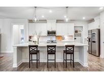 Modern kitchen with an island and stainless steel appliances at 6858 Hunts Mesa Dr, Fort Mill, SC 29707