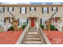Inviting townhouse with red front door and covered porch at 1465 Flintwood Dr, Rock Hill, SC 29732