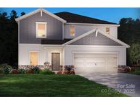 Charming two-story home with a gray and white exterior, landscaped yard and a two car garage at 149 Shepherds Landing Dr, Mooresville, NC 28115