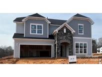 Charming new two-story home with gray siding, stone accents, and a spacious two-car garage at 2204 Camber Dr # Cwo0076, Gastonia, NC 28054